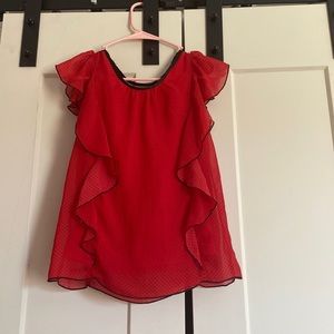 A red with black dot shirt very cute